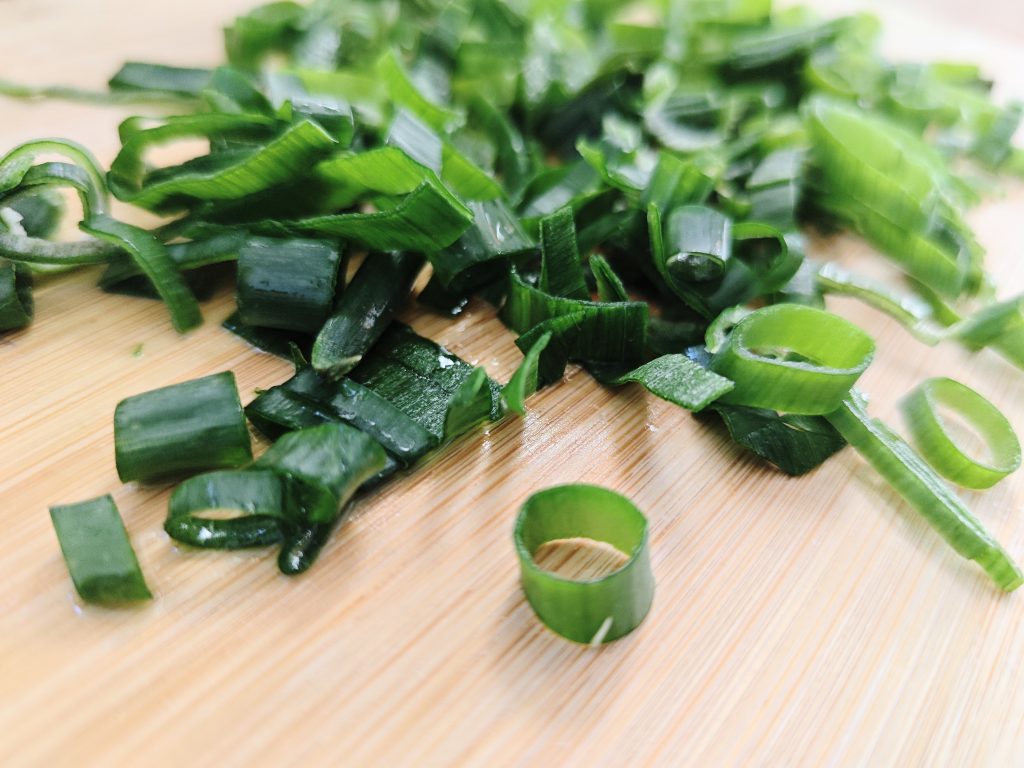 chopped green onions used as garnish adding fresh slightly sharp flavor to buffalo chicken