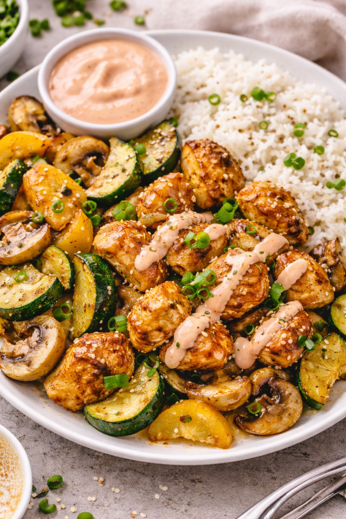 air fryer hibachi chicken with zucchini mushrooms and onions served on plate